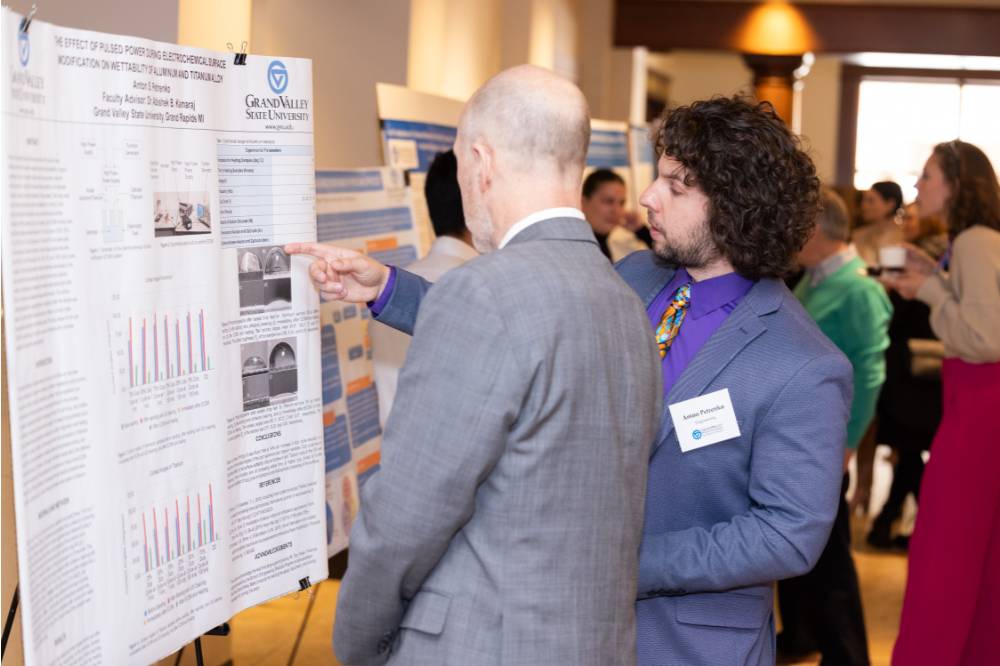 Anton (right) and Dr. Jeffrey Potteiger (left) at the 2023 Graduate Showcase.